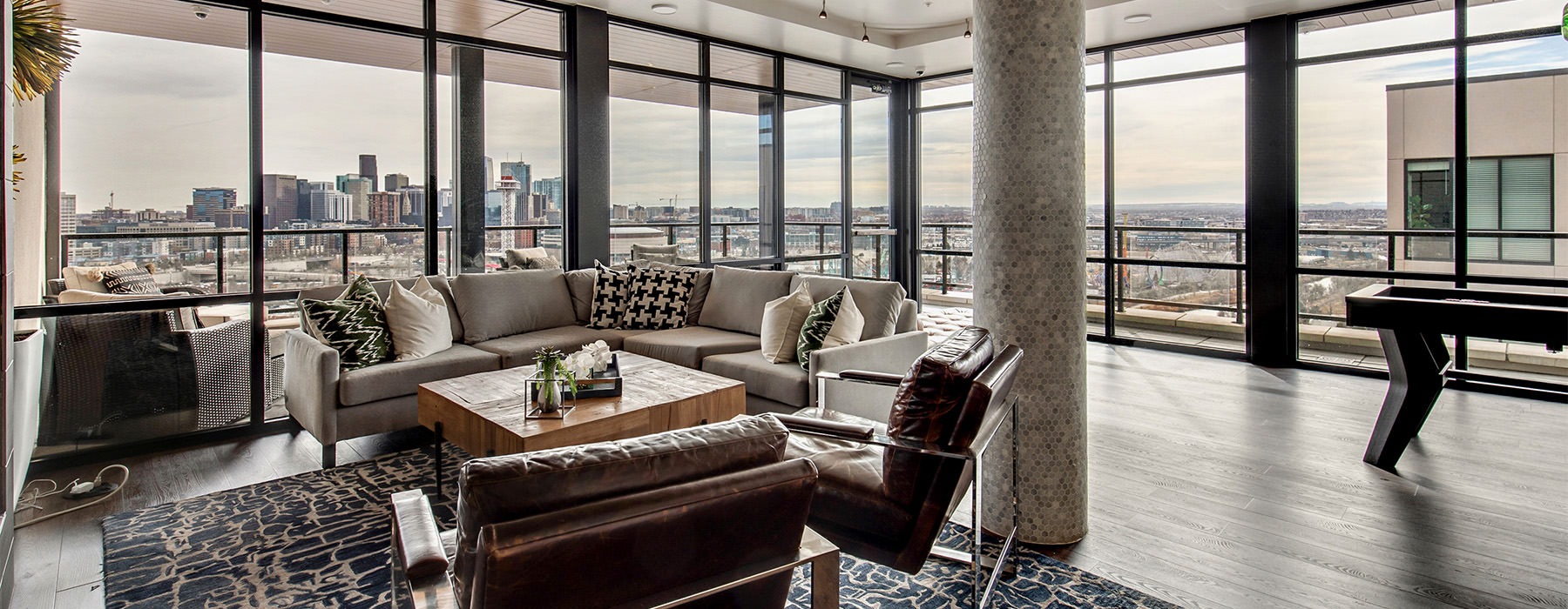 Lounge area in the leasing center overlooking the cityscape 