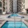 Pool area with reclining chairs and close proximity to aparments