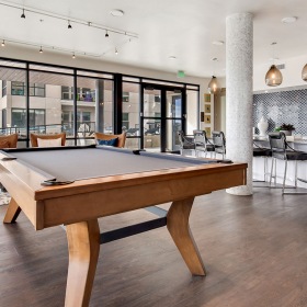 Resident Lounge Lounge area with pool table, bar area, and cityscape views