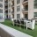 Outdoor lounge area with seating and grilling space