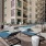 Pool with views of cityscape and a hot tub